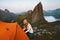 Tent camping in mountains hiker woman traveling in Norway alone