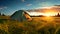 Tent in Field With Setting Sun. Hiking and outdoor recreation