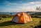 Tent on Grassy Hill Overlooking Ocean