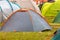 Tent on green grass in the rain