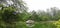 Tent house on a floating platform with reflection in Sanjay Lake in East Delhi