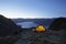 Tent By Lakeshore At Dusk