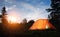 A tent lit up at dusk