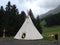 Tent, in the shape of a tipi, in a mountainous alpine holiday area