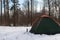 Tent in the snow, camping in winter,