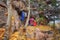 Tent on the top of the mountain hidden behind stones and fixed to the trees, sleeping bags