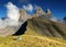 Tent under three peaks Aiguilles d\'Arves in French Alps, France.