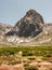 Tents camping under the huge mountain in unique white sand desert mountains in Patagonia, Chile. Sunny sky, active volcanos, white