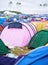 Tents, campsite and music festival on outdoor field or mess pollution, garbage from party crowd. Shelter, group and