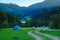 Tents and cars of campers in the Romanian mountains in the morning