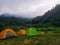 Tents on the hill, travelers spend the night.