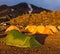 Tents tourists and glaciers covered with warm sunlight