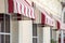 Tents and windows of a city cafe.