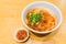 Teowchew Fishball noodles with soup and chili sauce on table