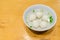 Teowchew Fishball noodles with soup and chili sauce on table