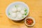 Teowchew Fishball with soup and chili sauce on table