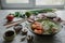 Teppanyaki fried rice with shrimp, mushrooms, green onion, pepper and herbs on light concrete background, asian food, healthy life