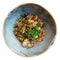 Teppanyaki mushrooms with green leek in earthenware bowl, isolated