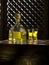 tequila anejo and glasses on color background