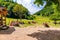 TERCHOVA, SLOVAKIA - 6.7.2019: Tourist are resting near small cottage house with name Koliba Podziar in Slovakia national park