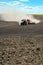 Terebovla region, Ternopil ,Ukraine - 14 September, 2019 : a spectacular dust train behind a tractor that plows and sows