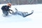 Teriberka, Russia - February 24, 2018: Man in a sports helmet rides a snowmobile