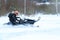 Teriberka, Russia - February 24, 2018: Man in a sports helmet rides a snowmobile