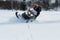 Teriberka, Russia - February 24, 2018: Man in a sports helmet rides a snowmobile