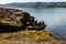 Teriberka, Russia - July 27, 2017: Group scuba divers sitting in the boats and checking their equipment before to dive