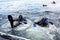 Teriberka, Russia - July 29, 2017: Two scuba divers diving from a boat into the water. Shot in Barents sea