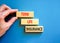 Term life insurance symbol. Concept words Term life insurance on beautiful wooden blocks. Beautiful blue table blue background.