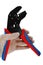 Terminal crimping press pliers with opened jaws, held in left hand in transparent glove used in electrotechnical installations, wh