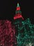 The Terminal Tower is lit up in a Christmas red and green with lights down below - Cleveland - OHIO