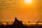 Termite Mound dominates scene at sunrise in grasslands of Okavango