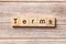 Terms word written on wood block. Terms text on table, concept