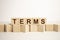 Terms word written on wood block. Terms text on table, concept