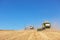 TERNOPIL - JULY 20: A few combines cutting a swath through the middle of a wheat field during harvest on July 20, 2017