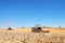 TERNOPIL - JULY 20: A few combines cutting a swath through the middle of a wheat field during harvest on July 20, 2017