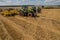 TERNOPIL REGION, UKRAINE - August 10, 2021: tractors CLAAS 950 Axion with trailed harrows Bednar at the demonstration of