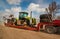 TERNOPIL REGION, UKRAINE - MARCH 29, 2019: A truck on a trailer transports a dismantled tractor to a repair base in preparation