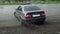 TERNOPIL, UKRAINE - MAY 10, 2019: Slow motion shot of sport car drifting in the rain