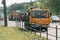 Ternopil, Ukraine, May 2020: Team of workers in protective uniforms work on road construction. Workers transportation