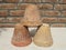 Terra cotta pots upside down piled closeup view