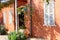 Terra cotta wall house shutters garden plants, Neve Tzedek, Tel Aviv