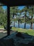 Terrace with chairs at country side house, waterfront vacation hotel.