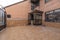 Terrace with clay terrazzo floors and brown aluminum and glass