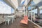 terrace en un loft penthouse with large window, glass door, garden table and chairs, orange hammock