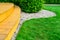 Terrace in formal garden after power washing - bright green lawn