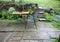 Terrace with garden furniture during heavy rain.