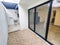 Terrace of a house with laundry room and glass doors